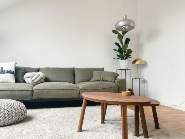 Minimalist Home - gray 2 seat sofa near brown wooden coffee table