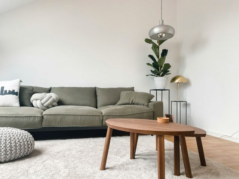 Minimalist Home - gray 2 seat sofa near brown wooden coffee table