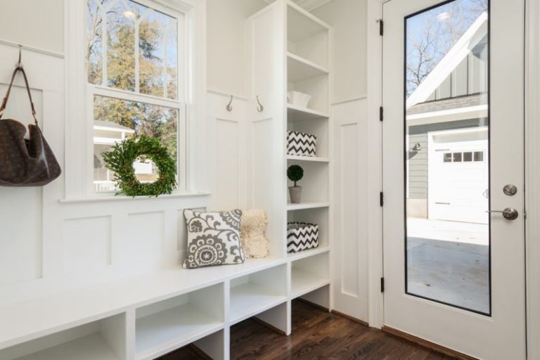 Mudroom Design - gray and white floral throw pillow beside rack inside room