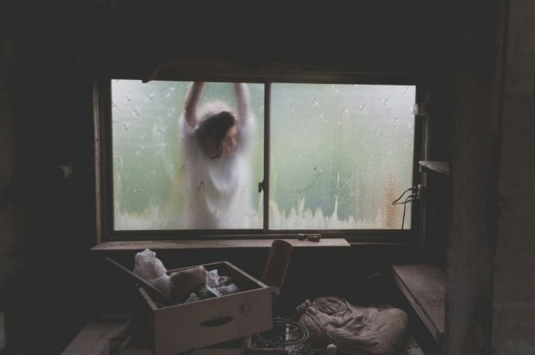 Basement Storage - woman leaning on window