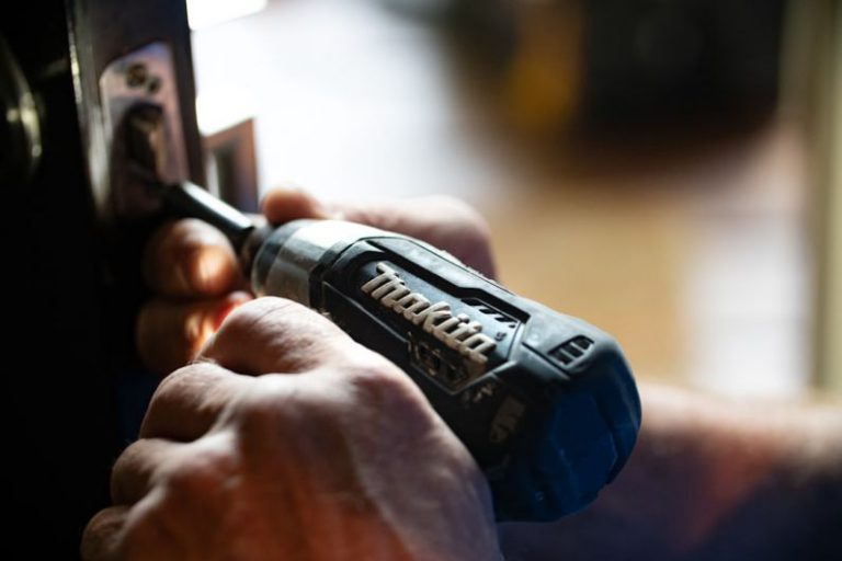 Choosing Contractor - selective focus photography blue and black Makita power drill