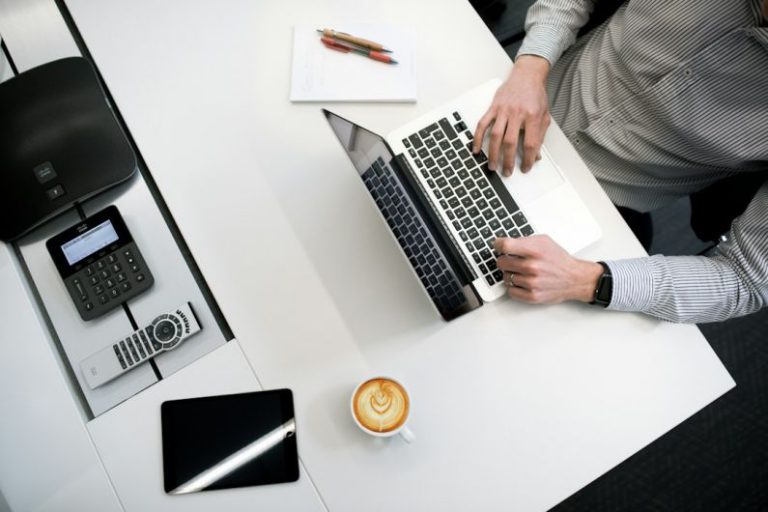 Flooring On A Budget - person using laptop on white wooden table