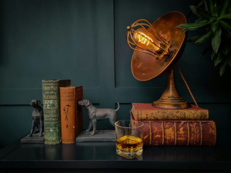 Furniture Repurposing - a table topped with books and a lamp