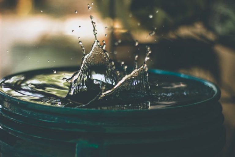 Water Saving Fixtures - water drop on bucket photo