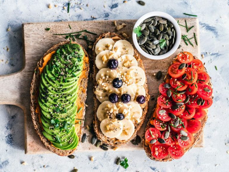 Vegan Food - assorted fruits and vegetable on brown wooden chopping board