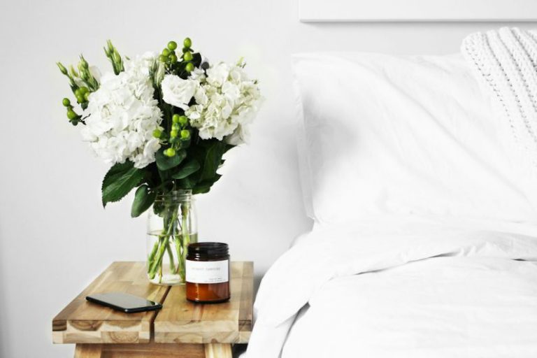 Eco Personal Care - flowers in clear glass vase on table