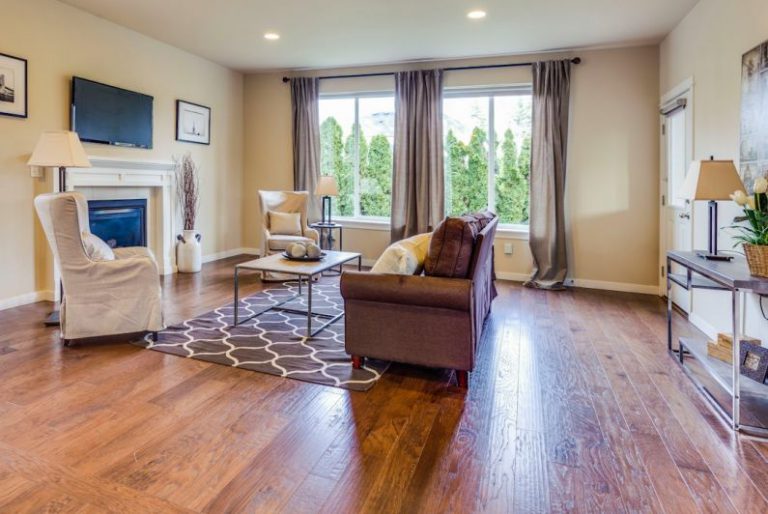 Hardwood Floors - a living room filled with furniture and a fire place