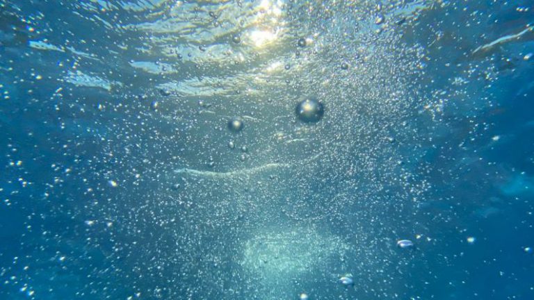 Water Saving - water bubbles in blue water