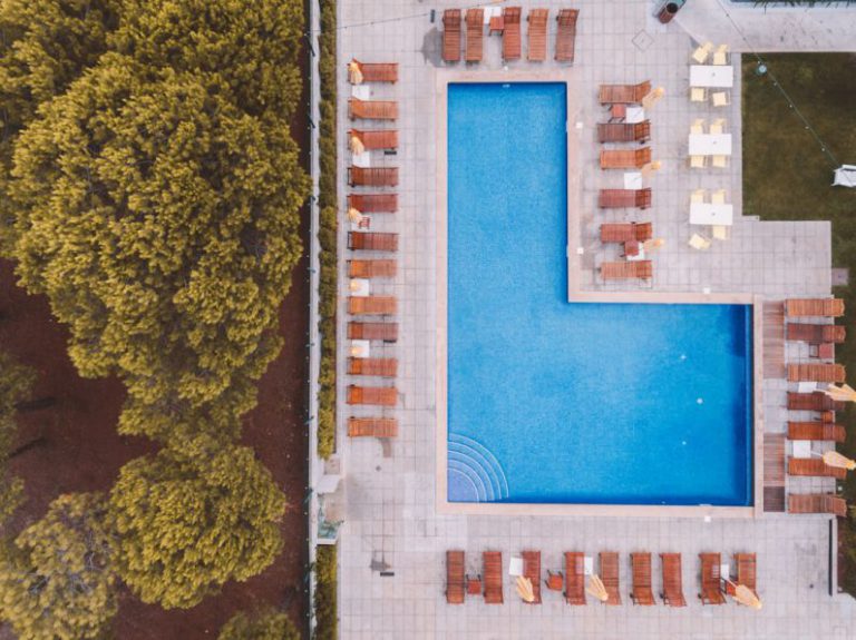 Clean Pool - bird'eye-view photography of swimming pool near trees