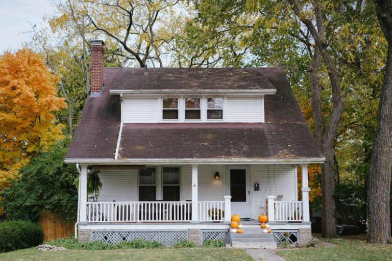 Home Inspection - trees beside white house