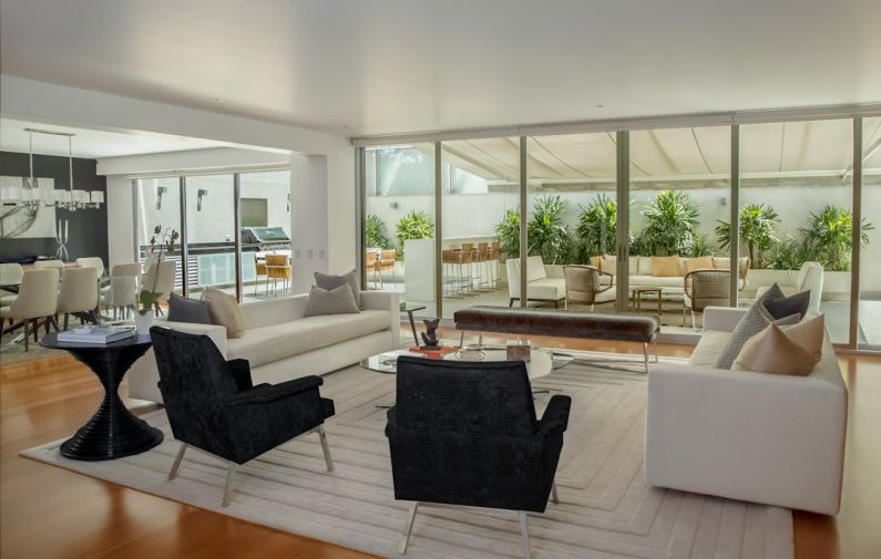 Biophilic Design - two black suede armchairs during daytime