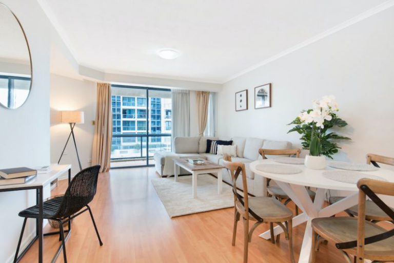 Open Plan Living - a living room filled with furniture and a dining room table