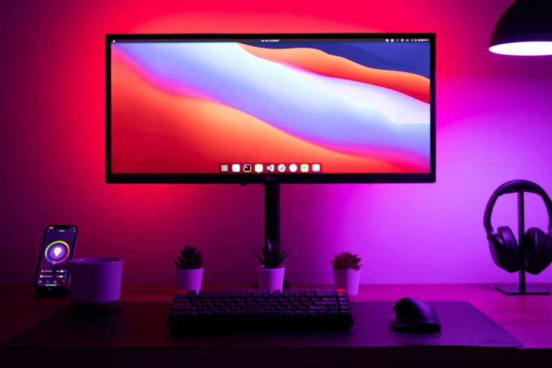 Smart Lighting - black flat screen computer monitor turned on beside black computer keyboard