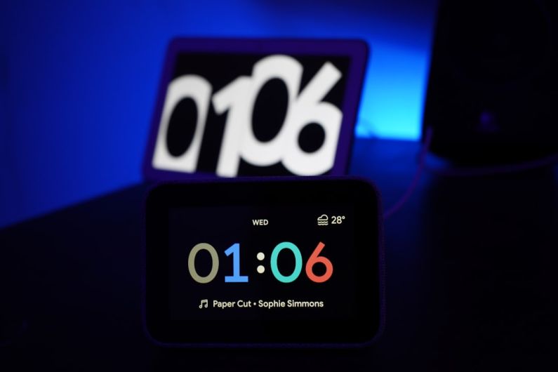 Smart Home Hub - black digital clock at 1:06